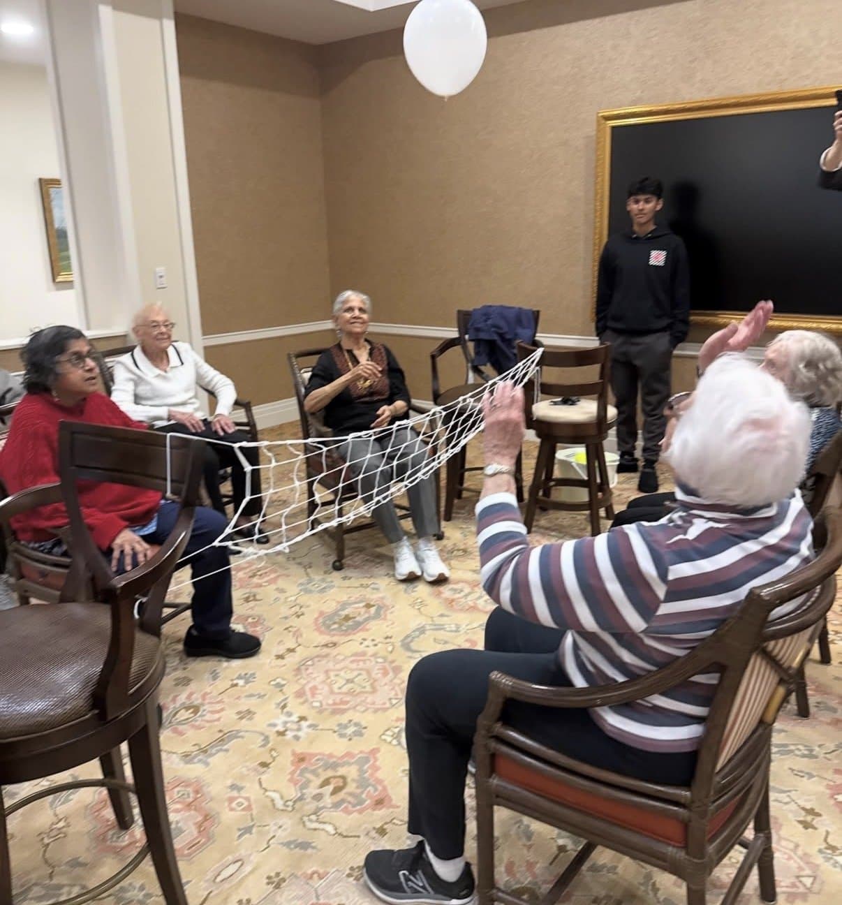 Residents playing balloon volleyball